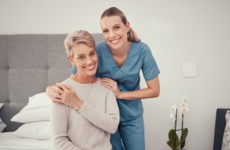 caregiver and senior smiling