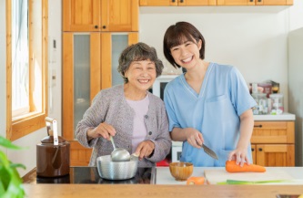 caregiver and senior cooking